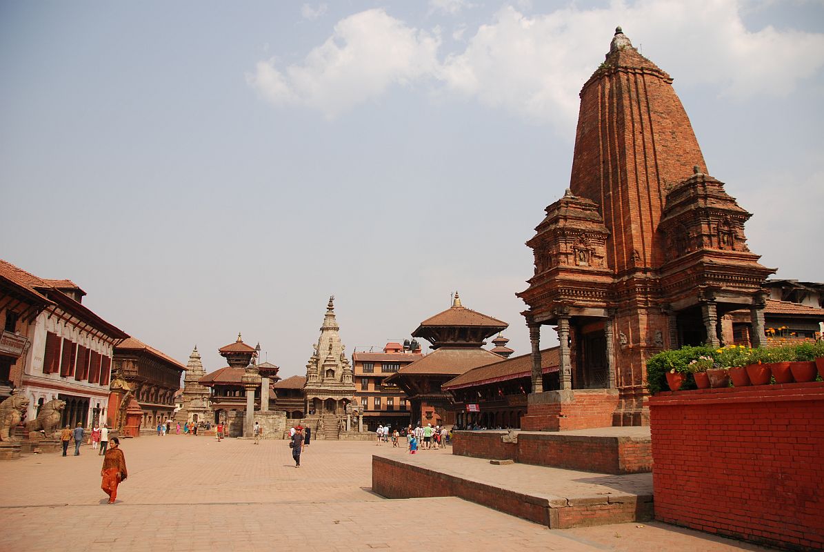 Kathmandu Bhaktapur 01 Bhaktapur Durbar Square From West With Shiva Kedarnath Temple Bhaktapur (1401m) is a traffic-free city 13 km east of Kathmandu, with cobblestone streets linking a string of temples, courtyards and squares. Bhaktapur Durbar Square is one of the world heritage sites in Nepal, reflecting the city's rich culture, art and architectural design. The 1934 earthquake destroyed many of Bhaktapurs Durbar Square temples. Here is a view of Bhaktapur Durbar Square from the west, with the Golden Gate and Palace of 55 Windows on the left, the Vatsala Durga Temple in the centre, and Shiva Kedarnath Temple on the right.